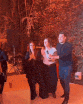 a group of people are posing for a picture and one of them is wearing a shirt that says ' i love you '
