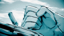 a blue and white drawing of a fist with a blue sky in the background