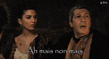 a man and a woman standing next to each other with the words ah mais non mais written on the bottom