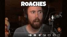 a video of a man with a beard and headphones is titled roaches