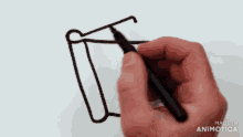 a person is drawing an open book with the letters a and b on it