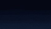 a white comet is flying through a dark blue sky