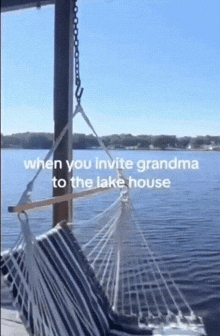 a hammock is hanging over a body of water with the words when you invite grandma to the lake house