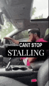 a man is driving a car with the words " when you cant stop stalling "