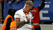 a soccer player with a sixt shirt on