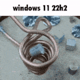 a picture of a copper coil with the words windows 11 22h2 on the top