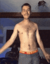 a shirtless man with a mustache is wearing a pair of underwear that says calvin klein