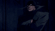 a man with a beard wearing a black mask and a black coat