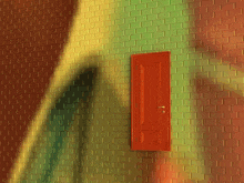 a brick wall with a red door in the middle