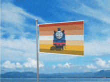 a thomas the tank engine flag is flying in the wind