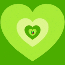a green frog with a yellow beak and a heart behind it