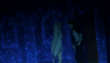 a man and a girl are standing in a dark room with blue lights