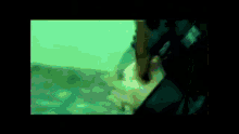 a man in a black jacket is singing a song