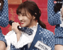 a girl with a name tag that says syeon