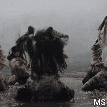 a group of women are kneeling in the water with the letters ms visible