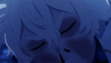 a close up of a person 's face in a blue light
