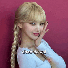 a woman with a braid and the word chae de val on her chest