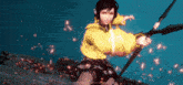 a girl in a yellow jacket is holding a sword in a video game