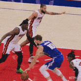 a basketball player wearing a number 10 jersey dribbles the ball