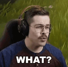 a man wearing headphones and glasses is making a funny face and saying what ?
