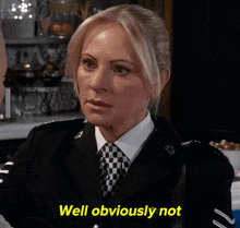 a woman in a police uniform says well obviously not in yellow letters