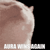 aura wins again written on a black background