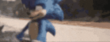 a blurry picture of sonic the hedgehog walking down a road