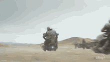 Riding Vehicles The Book Of Boba Fett GIF - Riding Vehicles The Book Of Boba Fett Moving On Vehicle GIFs