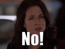 a woman is making a face and says no in white letters