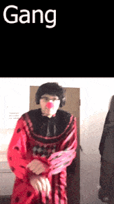 a person dressed as a clown with the word gang on the bottom right