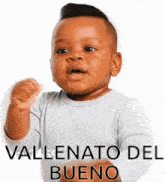 a baby is wearing a white shirt with the words vallenato del bueno written on it .