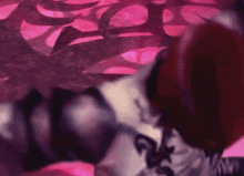 a man with a tattoo on his body is laying on the floor
