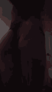 a woman 's butt is shown in the dark