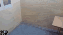 a blurred image of a person standing next to a chair with a question mark on it