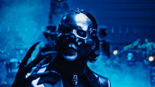 a person with a skull on their head and a top hat