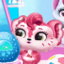 a pink and white animal with green eyes is sitting next to a blue ball