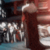 a blurry picture of a man in a red robe