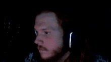 a blurry picture of a man with headphones on