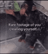 a chimpanzee is washing it 's hands in a sink with the caption rare footage of you cleaning yourself .