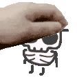 a close up of a person 's hand touching a cartoon skull .
