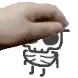 a close up of a person 's hand touching a cartoon skull .