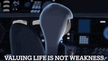 a cartoon character is sitting at a desk with the words valuing life is not weakness on the bottom