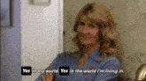a woman in a blue shirt is saying yes in my world yes in the world i 'm living in