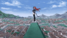 a woman with a cat tail stands on top of a hill overlooking a town