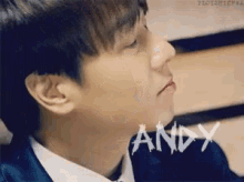 a close up of a man 's face with the name andy written on the bottom