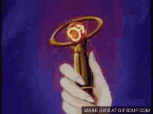 a gif of a person holding a trophy with a male symbol on it
