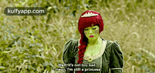 a woman dressed as shrek says well it 's not too bad i 'm still a princess