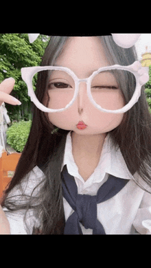 a girl wearing glasses with bunny ears on them makes a funny face