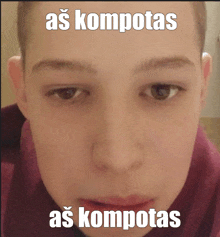 a close up of a person 's face with a caption that says as kompotas as kompotas
