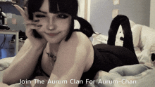 a girl laying on a bed with the words " join the aurum clan for aurum-chan "